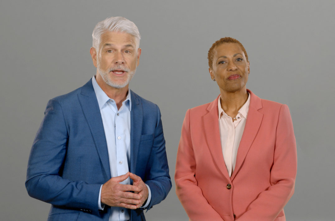 Man and woman standing and hosting